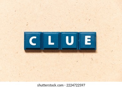 Tile Letter In English Word Clue On Wood Background