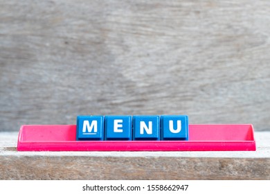 Tile Letter On Red Rack In Word Menu On Wood Background