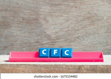 Tile Letter On Red Rack In Word CFC (abbreviation Of Chlorofluorocarbon) On Wood Background