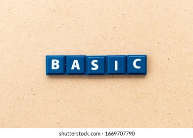 Tile letter in word basic on wood background