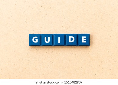 Tile Letter In Word Guide On Wood Background