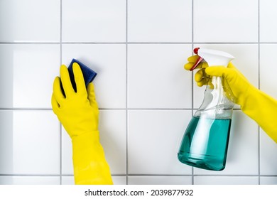 Tile Wall Grout Cleaning With Sponge And Goggles