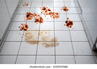 Tiled Floor With Spilled Food In Kitchen