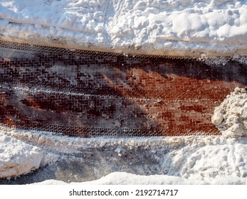 Tiled Road In A Snowy Yard. Car Trail In Snowdrifts. Electric Car Trail In The Snow. Aerial View.