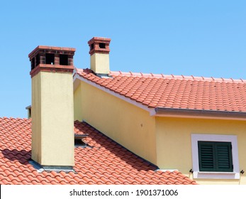 Tiled roof with chimneys and one window, part of yellow house, Croatian style - Shutterstock ID 1901371006
