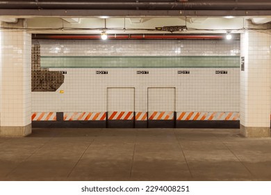 Tiled wall in underground subway station in Manhattan New York - Powered by Shutterstock