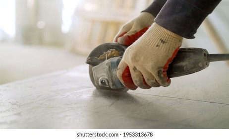 The Tiles Are Cut With A Special Saw For A Perfect Fit. A Craftsman Saws Ceramic Tiles.