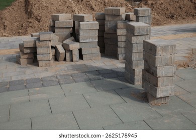 Tiles paving Tile Stack. pallets and packages of freshly produced red bricks in a construction warehouse on the street. Concept of repair and building materials