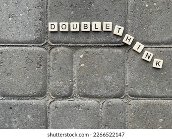 Tiles spelling doublethink, as a reference to the George Orwell novel 1984 