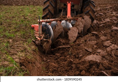 Tilling And Prepare Soil For Planting By Machine Tools For Plowing Field Or A Tractor. Agricultural Industry That Requires The Use Of Machinery To Help Reduce The Amount Of Work And Workload.