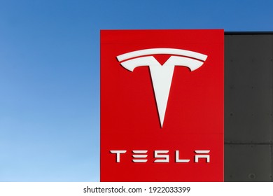 Tilst, Denmark - February 14, 2016: Tesla logo on a wall. Tesla is an American automotive and energy storage company that designs, manufactures, and sells luxury electric cars