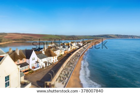 The tilt shift blur effect image of the village of Torcross overlooking Slapton Sands on the south coast of Devon