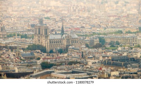 TILT SHIFT EFFECT - Aerial view of Paris, France. Notre Dame de Paris Cathedral, Paris, France. The spire.