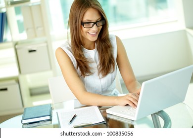 Tilt Up Of Smiling Woman Being Busy Working In The Middle Of The Day