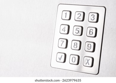 Tilted metallic numeric keypad panel