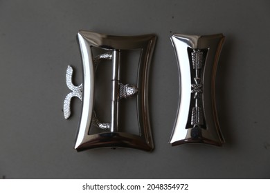 Timang is the Javanese name for traditional buckle. They are usually made of silver, copper or gold and each design has its own name. this one is called Gandewo Pinentang.