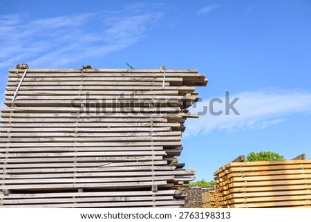 Timber awaiting transport at a lumber processing plant