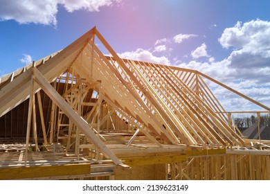 Timber frame house of gables roof on stick built home under construction new build roof with wooden beam framework - Shutterstock ID 2139623149