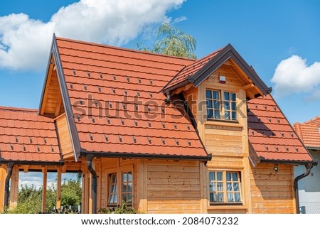 Timber frame house. The wooden house was built using frame technology.