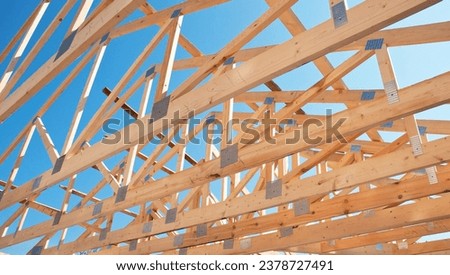 Timber framing, wooden structural framework. Wooden framework during house roofing construction. 