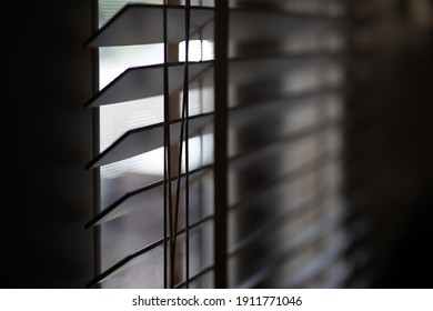 Timber Venetian Blinds On Window Casting Shadows