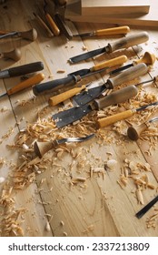 Timber, wood processing. Joinery work. Wood carving with work tools close up. Hand of carver carving wood. Craftsman carving with a gouge
