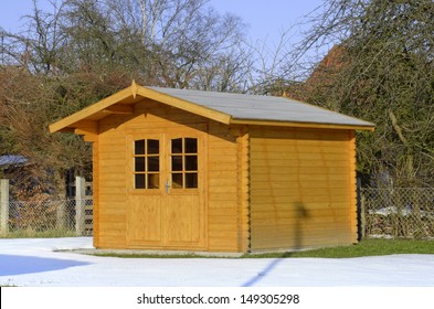 Timbered garden shed in snow