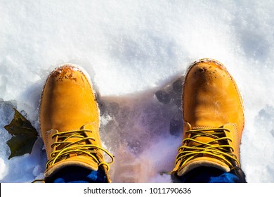 Timberland boots in the snow - Shutterstock ID 1011790636