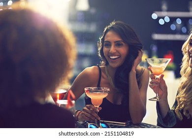 Is it time for another round yet. Shot of a group of friends relaxing with cocktails in a nightclub. - Powered by Shutterstock