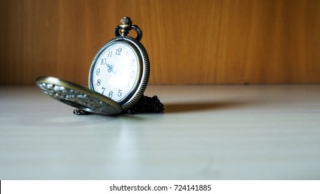 Time with antique clock and background