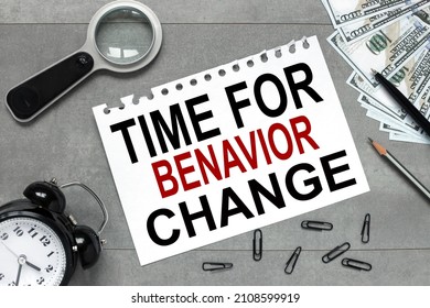 Time To Behavior Change Symbol. White Sheet Of Paper Alarm Clock Money On A Gray Background. Business, Growth And Time To Behavior Change Concept. Copy Space.