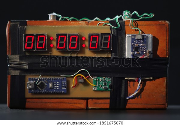 Time Bomb is Going to Explode or Detonate per 1\
Second. Terrorist Threat. Dynamite with Clockwork. Explosives with\
Detonator. Bomb with Red Timer on Black Background. Improvised\
Explosive Device. TNT