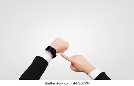 Time, Business And New Technology Concept - Close Up Of Businessman Pointing To Smart Watch At His Hand