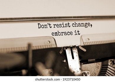 Time to change symbol. Text Do not resist change embrace it typed on retro typewriter. Business and time to change concept. Beautiful background. Copy space. Sepia effect.