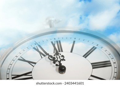 Time concept. Double exposure of blue sky with fluffy clouds and clock - Powered by Shutterstock