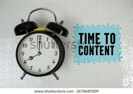 Time To Content text with alarm clock on blue background