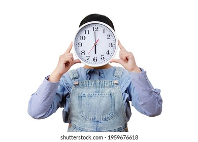 Time and daily life concept, Happy Asian little girl hand holding a big clock hide her face in the white background, Copy space, save the Clipping path.