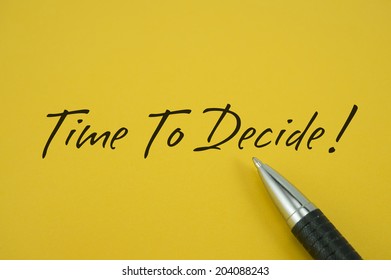 Time To Decide! note with pen on yellow background