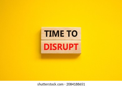 Time to disrupt symbol. Concept words Time to disrupt on wooden blocks on a beautiful yellow background. Business and time to disrupt concept. Copy space.