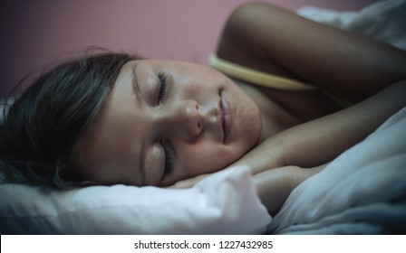It's time for the dream land. Little girl sleeping in bed. Close up. Space for copy. - Shutterstock ID 1227432985