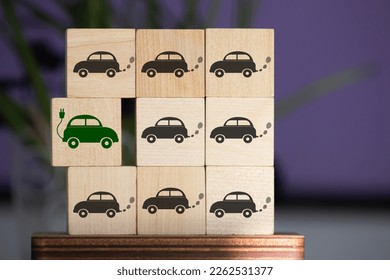 it's time for electric cars, a concept on wooden cubes.