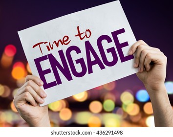 Time to Engage placard with night lights on background - Shutterstock ID 436291498