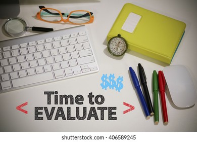 TIME TO EVALUATE concept on white desk in the office , business concept , business idea ,  online marketing , analysis concept