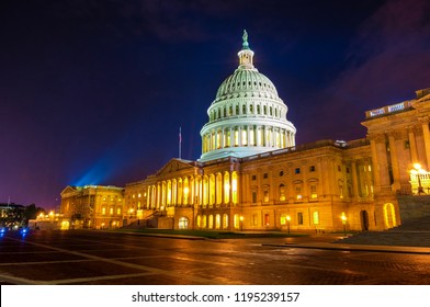 Time Exposure Of The East Entrance To The White Marble United States Capital Building At Night With Spot Lights Illuminating The Dome.