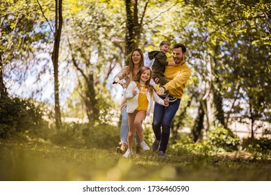  It's Time For Family Quality Time.  Parents Spending Time With Their Children Outside..