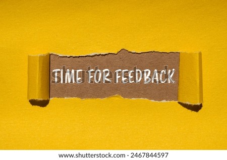 Time for feedback words written on ripped yellow paper with brown background. Conceptual time for feedback symbol. Copy space.