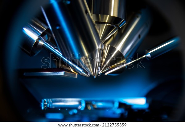 Time of flight mass spectrometer in closeup shot\
with blue light