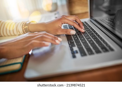 Time To Get Down To Work. Closeup Shot Of An Unrecognizable Woman Working On A Laptop At Home.