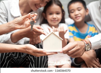 Time Of Happiness Family With Real Estate Agent. Buying A New House. Or Real Estate Agent Offer Home Ownership And Life Insurance To Young Family,Start A Family Life, Stability, Future Of Children.