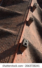 Time honored tiled roof and brick chimneys, top view - Shutterstock ID 2063728241